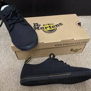 Dr Martins black Canvas shoe. stitching.